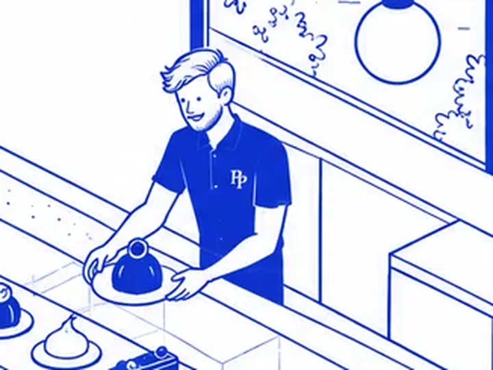 Glenn holding the pear cake behind the counter at Percy Pastries